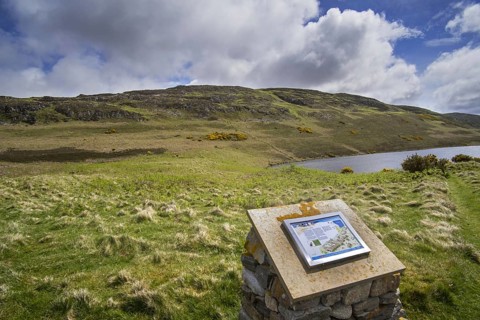 Information board about the Achanlochy Clearance Village on the shore of Loch Duinte near