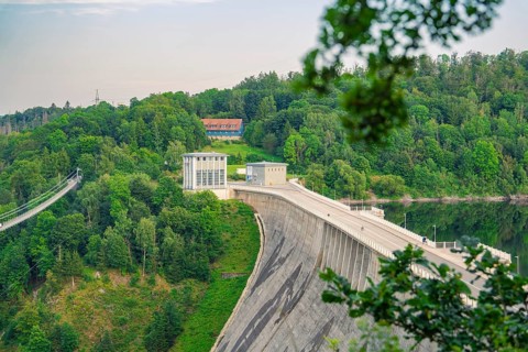 Large dam in a hilly landscape with many trees and lush greenery, Rappbode Dam, Harz Mountains,