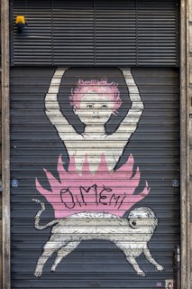 Graffiti on a closed shutter in the historic centre, Genoa, Italy, Europe