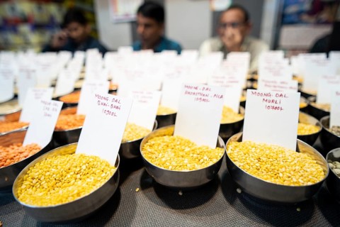 Samples of pulses kept on display inside a shop at a wholesale market ahead of the presentation of