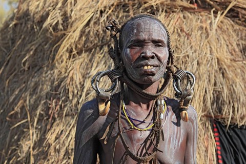 South Ethiopia, in the Maco National Park, Mursi tribe, older Mursi woman with naked upper body and