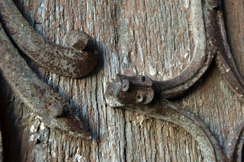 Orcival. Intricate Roman wrought iron hinge displayed at the Basilica Notre-Dame d'Orcival, Puy de