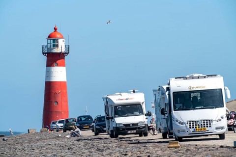 North Sea dyke near Westkapelle, Westkapelle Laag lighthouse, motorhome parking on the dyke, day