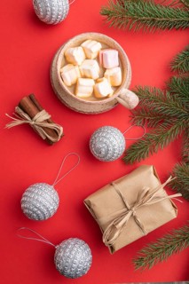 Christmas or New Year composition. Decorations, box, cinnamon, silver balls, fir and spruce
