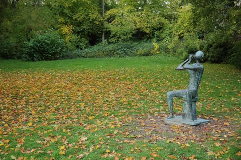 Flute player by Walter Wadephul 1965 in autumn, park, lawn, fallen leaves, leaf fall, autumn, spa