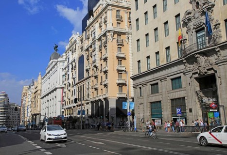 Traffic historic buildings busy road of Gran Via, Madrid city centre, Spain, Europe