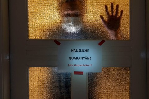 Symbolic image Domestic quarantine, man is in isolation at home due to a suspected corona