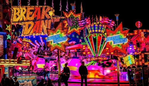 Breakdance fair ride at night with colourful lights, Cannstatter Wasen, Bad Cannstatt, Stuttgart,