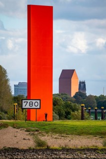 The sculpture Rhine Orange at the mouth of the Ruhr into the Rhine, skyline of the city centre of