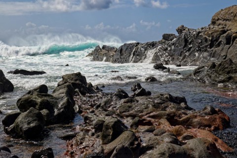 Lava rocks at the Playa de los Ciclos near the Green Lake, Lago Verde, El Golfo, Lanzarote, Canary
