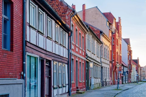 Half-timbered houses in the street Altes Dorf, a street with cobblestones, in the old town centre