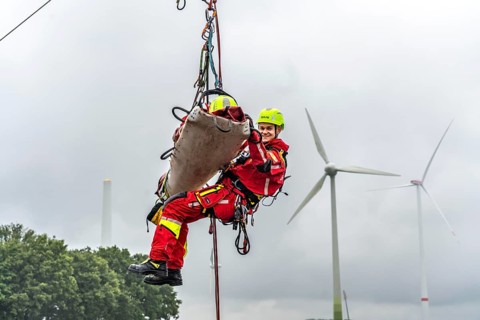 Height rescuers from the Oberhausen professional fire brigade practise abseiling from a wind