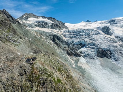 Mountain hut Cabane de Moiry, located close to the retreating Moiry glacier, hiking trail, aerial