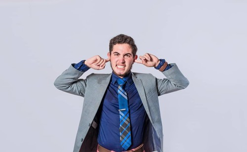 Man covering his ears isolated, guy covering his ears on isolated background, man with hands on his