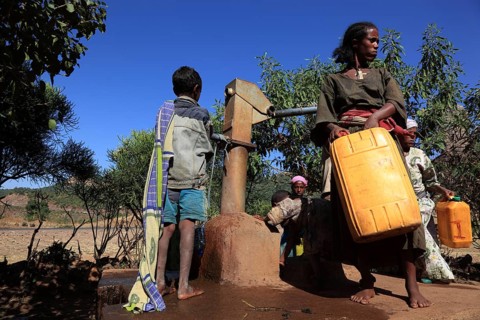 Amhara region, locals fetching water from a well, Ethiopia, Africa