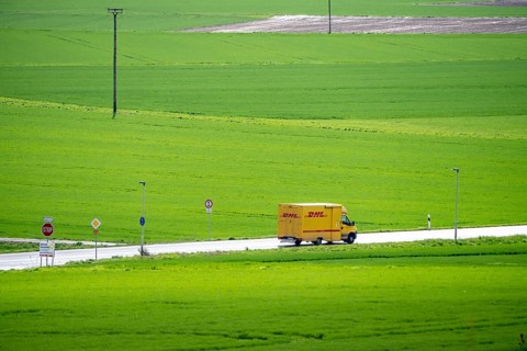 B519 country road near Flörsheim, DHL parcel service van, Hesse, Germany, Europe