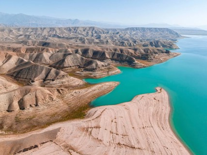 Barren landscape, aerial view, erosion landscape with canyons on the Naryn River, Toktogul