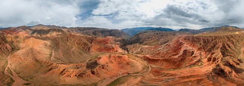 Panorama, Eroded mountain landscape, Canyon with red and orange rock formations, Aerial view,