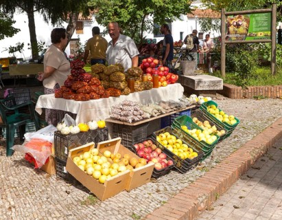 Selling chestnuts at a fruit and vegetable market stall in the village of Galaroza, Sierra de