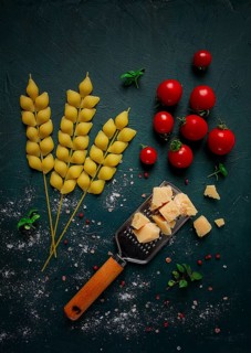 Food concept, pasta, with cherry and parmesan cheese, top view, no people, wheat, pasta spikelets