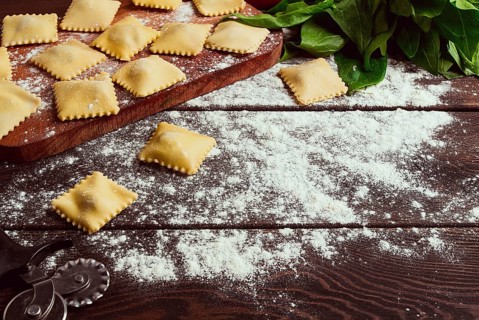 Cheese Ravioli, with spinach and cheese, with ingredients, on a wooden table, horizontal, no
