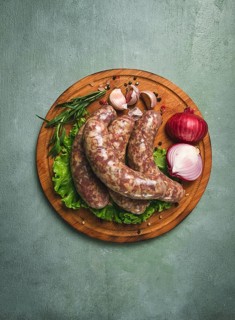 Raw kupaty, traditional Georgian sausages, raw sausages, with spices and herbs, Georgian cuisine