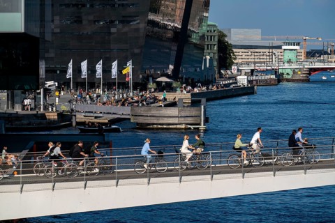 Cyclists on the Lille Langebro cycle and pedestrian bridge over the harbour, Copenhagen is