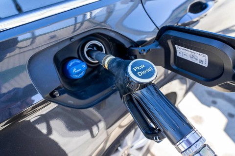 Diesel car is refuelled with diesel fuel, petrol station