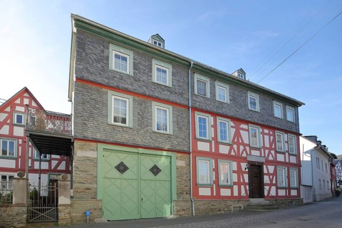 Official pharmacy built in 1805, historic half-timbered house, slate house, Runkel, Westerwald,