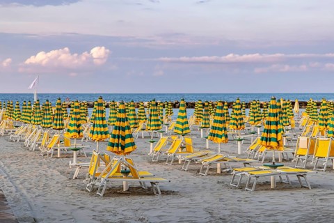 Bathing beach on the Adriatic in bad weather. All deckchairs are free. Bellaria-Igea Marina,