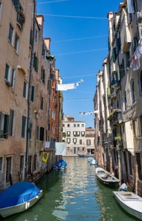 Clotheslines across a canal in the Cannaregio district, Venice, Veneto, Italy, Europe