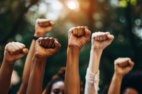 Close up of women's raised fists. KI generiert, generiert, AI generated