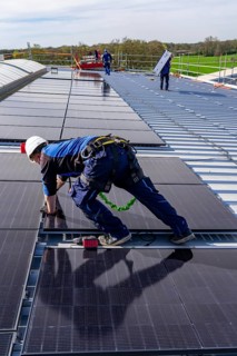 Installation of solar modules on the roof of a commercial enterprise, over 400 photovoltaic modules