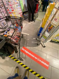 Effects of the corona crisis in Germany, sticker on the floor informs customers of a supermarket
