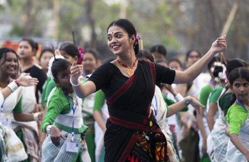 An instructor dance Bihu, as she teach participants during a Bihu dance workshop, ahead of Rongali