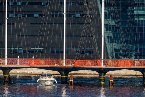 Cyclists on the Cirkelbroen cycle and footpath bridge, over the harbour, in the Christianshavens