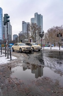 Puddle, winter in the city, Deutsche Bank building, Sparkasse, Trianon Frankfurt building,