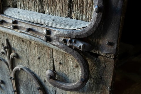 Orcival. Intricate Roman wrought iron hinge displayed at the Basilica Notre-Dame d'Orcival, Puy de