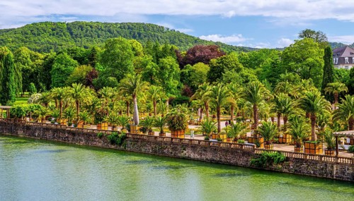 Castle moat with palm garden in the spa gardens, the largest outdoor palm garden north of the Alps,