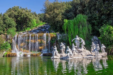 Fountain sculptures at the water basins in the garden of the royal palace Palazzo Reale, Italian
