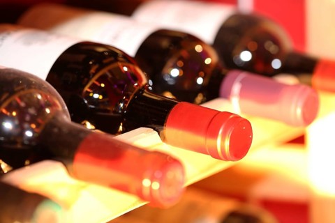 Wine cellar with red wine bottles