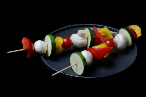 Colourful vegetable skewers on a plate, barbecue skewers