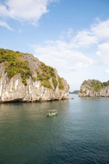 Fishing boat and the karst rocks in Lan Ha Bay, Halong Bay, Vietnam, Asia