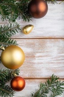 Christmas or New Year composition. Decorations, box, golden balls, cinnamon, fir and spruce