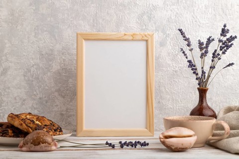 White wooden frame mockup with lavender in ceramic vase, linen textile, cup of coffee and bun on