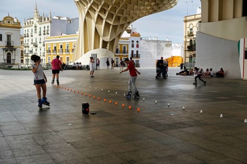 Inline skaters and pedestrians on the Plaza Mayor, Metropol Parasol, Seville, Andalusia, Spain,