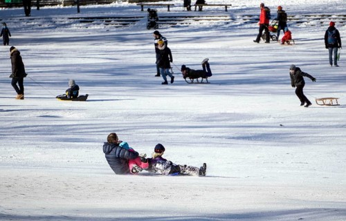 Tobogganing fun in Berlin's snow-covered Viktoriapark. Snow and icy cold continue to dominate the