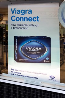 Boots chemist shop window Viagra Connect advertising poster, Calne, Wiltshire, England, UK