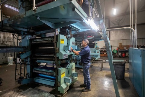 Liberal, Kansas, Danny Moura runs the printing press at the Leader & Times. Besides its own paper,
