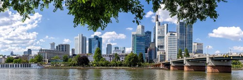 Skyline panorama with skyscrapers in the city centre, river Main and Untermainbrücke in Frankfurt,